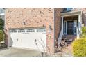 Brick front exterior with a double-door entry and attached garage at 912 Jewel Stone Ln, Morrisville, NC 27560