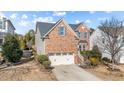 Beautiful two-story brick home featuring an attached two-car garage and meticulous landscaping at 912 Jewel Stone Ln, Morrisville, NC 27560