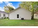 Rear view of the house showcasing a spacious backyard at 1000 N Mckay St, Dunn, NC 28334