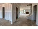 Open-concept living area with a fireplace and staircase, perfect for modern living at 110 Tennyson Dr, Garner, NC 27529
