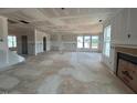 Spacious living room features a fireplace, lots of natural light, and an open concept design at 110 Tennyson Dr, Garner, NC 27529