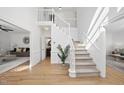 Bright entryway with hardwood floors and staircase at 1800 Deer Fern Dr, Raleigh, NC 27606