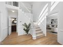 Bright entryway with hardwood floors and staircase at 1800 Deer Fern Dr, Raleigh, NC 27606