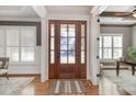 Bright entryway with hardwood floors and a view into an office at 305 Melvin Jackson Dr, Cary, NC 27519