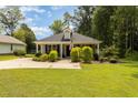 House exterior showcasing a well-maintained lawn and a welcoming front porch at 619 Barbour St, Clayton, NC 27520