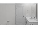 Double vanity bathroom with a door to another room at 7565 Michelle Rd, Rocky Mount, NC 27803