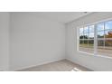 Bright bedroom with large window and neutral wall colors at 7565 Michelle Rd, Rocky Mount, NC 27803