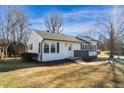 Updated ranch house with fresh exterior paint, landscaping, and a spacious yard at 803 Oakley St, Graham, NC 27253