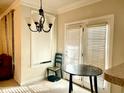 Small dining area with table and chairs near French doors at 814 Providence Glen Dr, Chapel Hill, NC 27514