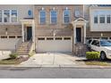 Three story townhome with 2-car garage and driveway at 8352 Primanti Blvd, Raleigh, NC 27612