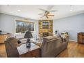 Living room with stone fireplace and wood floors at 8437 Charlie Stovall Rd, Oxford, NC 27565