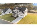 Two-story house on a large lot with a landscaped yard at 88 Tennyson Dr, Garner, NC 27529