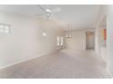Bright living room with vaulted ceiling, carpet, and French doors at 9104 Colony Village Ln, Raleigh, NC 27617