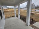 Covered front porch with view of the neighborhood and grassy area at 1013 Prominence Dr., Homesite 22, Durham, NC 27712