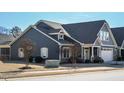 Two-story house with gray siding, white trim, and landscaping at 116 Telluride Trl, Garner, NC 27529