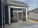 Screened porch with gray railings and a concrete patio at 1315 Richfield Oaks Dr, Homesite 3, Fuquay Varina, NC 27526