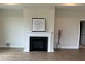 Stylish living room featuring a fireplace with white mantel and lovely decor at 134 Oban Dr, Homesite 133, Sanford, NC 27330