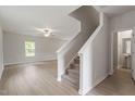 Bright living room with hardwood floors and access to a half-bathroom at 207 Shelfit Trl, Oxford, NC 27565