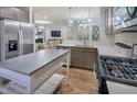 Kitchen boasts stainless steel appliances and breakfast bar at 2904 Huxley Way, Apex, NC 27502