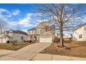 Two-story house with a neutral color scheme and a two-car garage at 309 Coalyard Dr, Garner, NC 27529