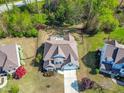 Beautiful aerial view of the house, showing the roof, backyard, and landscaping at 347 Country Mill Way, Fuquay Varina, NC 27526