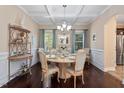 Elegant dining room featuring a round table and hardwood floors at 347 Country Mill Way, Fuquay Varina, NC 27526