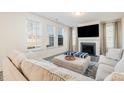 Spacious living room featuring a cozy fireplace and ample natural light at 370 Hickory Run Ln, Franklinton, NC 27525