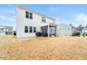 Home's backyard features a screened porch, patio, and grassy area at 53 Albereto Dr, Clayton, NC 27527