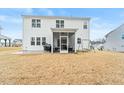 Home's backyard features a screened porch, patio, and grassy area at 53 Albereto Dr, Clayton, NC 27527