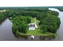 Waterfront property featuring a large home and private dock at 5891 Baker Ln, Rocky Mount, NC 27803