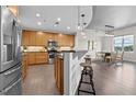 Modern kitchen featuring stainless steel appliances, granite countertops, and breakfast bar at 618 N Boylan Ave # 826, Raleigh, NC 27603