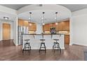 Bright kitchen features pendant lighting, breakfast bar and stainless appliances at 618 N Boylan Ave # 826, Raleigh, NC 27603