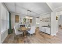 Elegant dining room featuring hardwood floors and chandelier at 7152 Rex Rd, Holly Springs, NC 27540