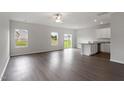 Open concept living area with kitchen and sliding glass door at 821 Rhino Bnd, Oxford, NC 27565