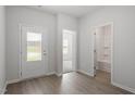 Entryway featuring a glass door, natural light, and doorways to other rooms at 910 Rhino Bnd, Oxford, NC 27565