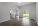 Open living room with sliding glass doors leading to the backyard at 910 Rhino Bnd, Oxford, NC 27565