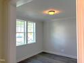 Bright room with two windows, hardwood floors, and neutral walls, perfect for an office or guest room at 9164 Dupree Meadow Dr # 14, Angier, NC 27501