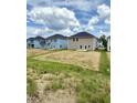New construction homes with spacious backyards and blue skies overhead at 111 Southern Estates Dr, Sanford, NC 27330