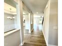 Inviting foyer featuring light wood floors and an open view to the dining room and living area at 111 Southern Estates Dr, Sanford, NC 27330