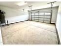 A clean, empty two-car garage with a concrete floor and white door at 111 Southern Estates Dr, Sanford, NC 27330
