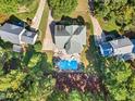 Aerial view of house, pool, and surrounding neighborhood at 124 Dallavia Ct, Morrisville, NC 27560