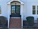 Elegant front entrance with double doors and brick steps at 124 Dallavia Ct, Morrisville, NC 27560