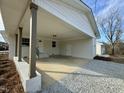Attached carport with ample space for two vehicles and extra storage at 209 Carolyn Dr, Benson, NC 27504