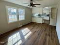 Bright and spacious living area with new flooring and lots of natural light at 209 Carolyn Dr, Benson, NC 27504