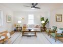 Cozy living room with neutral tones, stylish decor, hardwood floors, and a comfortable seating arrangement at 211 Long Ave, Graham, NC 27253
