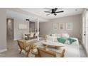 Bright living room with modern furniture, light wood floors, and French doors at 3 Patriot Cir, Durham, NC 27704