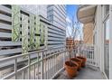 Balcony view with city views and potted plants at 317 W Morgan Street # 405, Raleigh, NC 27601