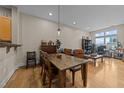 Dining area with a wooden table and chairs, adjacent to the kitchen at 317 W Morgan Street # 405, Raleigh, NC 27601