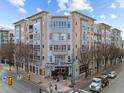 Attractive exterior of a modern multi-story condo building featuring balconies, detailed architecture, and street-level access at 317 W Morgan Street # 405, Raleigh, NC 27601