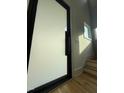 Modern entryway featuring a sleek, large door, leading to the hardwood staircase and bright interiors at 324 Waldo St, Cary, NC 27511